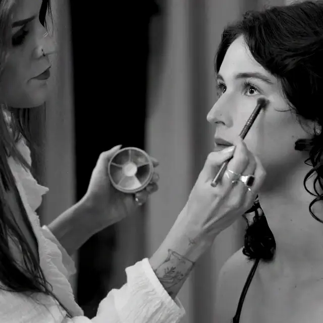 Black and white backstage makeup footage from a real casting preparation moment
