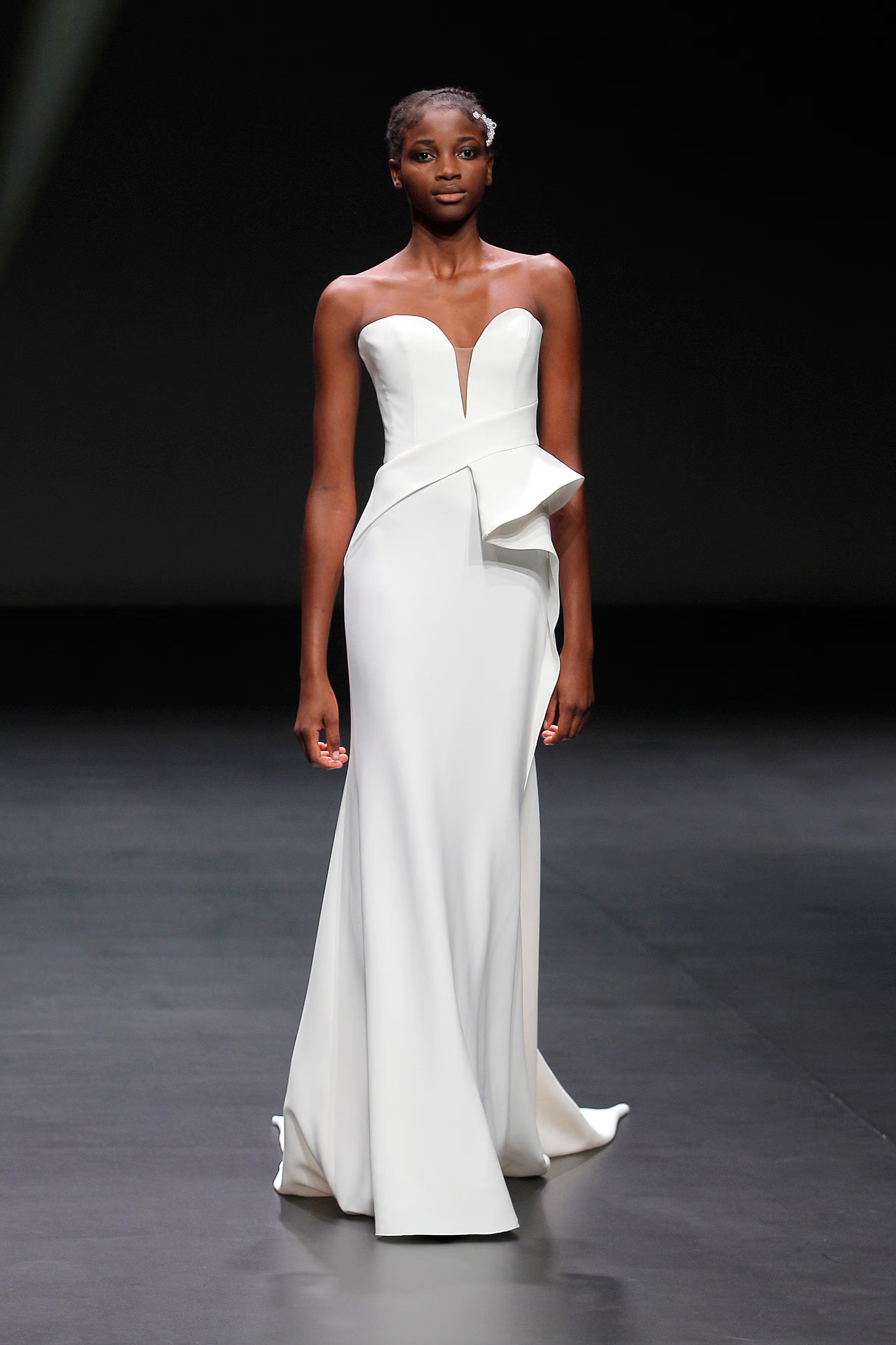 Runway model in a white gown